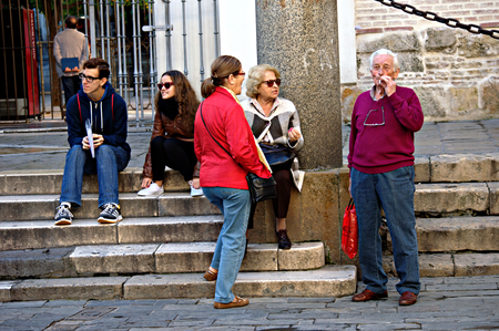 Sevilla, Spain, 11th September 2015 - Urban life - People standing in the streetのeditorial素材