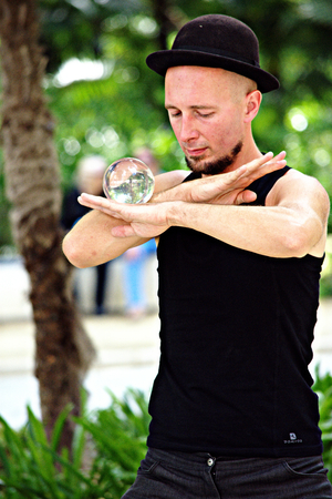Seville - Spain - 30th May 2016 - Juggler with crystal ball