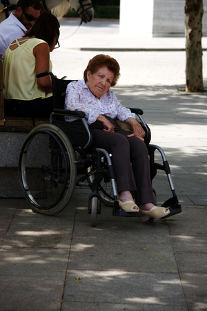 Seville - Spain - 24 May 2016 - Urban life. Old lady in a wheelchairのeditorial素材
