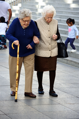 Seville, 1st November 2016 - Urban life , Old ladies walking in the streetのeditorial素材