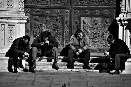 Seville, 8th February 2017 - Urban life, men sitting in the streetのeditorial素材