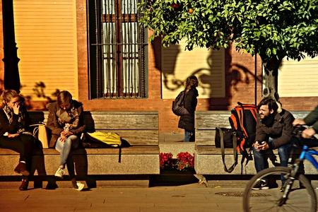 Seville, 8th February 2017 - Urban life. People sitting in the streetのeditorial素材