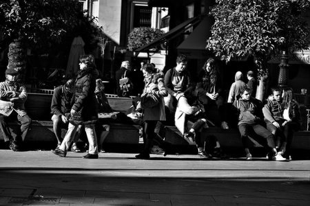 Seville, 8th February 2017 - Urban life - People sitting in the streetのeditorial素材