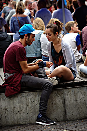 Brughes (Belgium) 12-7-2017  Urban life -  a couple sitting outdoorsのeditorial素材