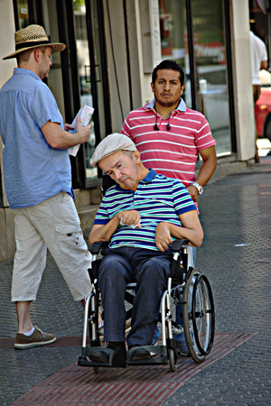 Sevilla, Spain, 13/9/2017 - Urban life - Invalid gentleman in a wheelchairのeditorial素材