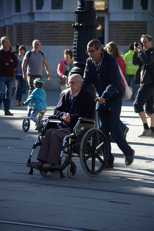 Seville, Spain, 10th November 1917 - Urban life. Disabled man on a wheelchairのeditorial素材