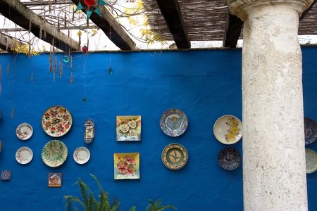 Ceramics plates on a blue wallのeditorial素材