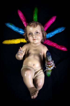 Still life with color condoms and a Child Jesusの写真素材