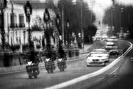 This is a somewhat abstract photography of the busy traffic in the center of Sevilleの写真素材