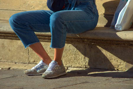 This is a photograph of ordinary (and anonimous) peope in the street. Urban photography in Seville.の写真素材