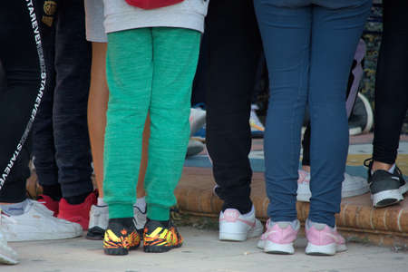 This is a photograph of ordinary (and anonimous) peope in the street. Urban photography in Seville.の写真素材