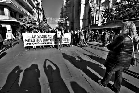 The tendency in the regional right wing government is to prrivatise the Spanish National Heath Service. This is a demonstration protesting against that trendのeditorial素材