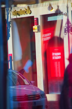 This is a rather abstract composition made from reflections in the streets of Seville