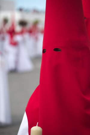 The brotherhood of Saint Blaise is a very popular institution. Every year they celebrate a procession. The penitent are dressed in colorful red and white tunicsの写真素材