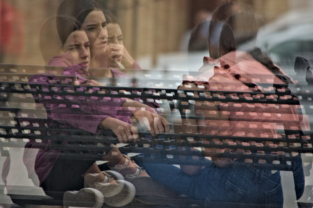 These are people in the street. This photo has a multiple exposition