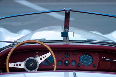This a detail of an ancient car from the early 1950s. It is used as an advertisement