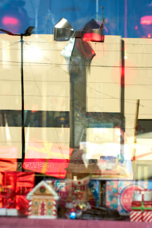 This is a colorful reflection of modern buildings reflected on a shop window