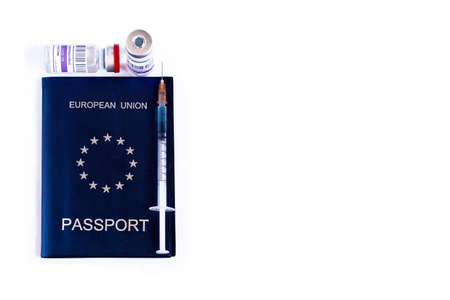 Covid passport or green travel certificate. European Union passport, vaccines and syringe. The need for vaccination for world travel and pandemic control. EU health passport concept.の写真素材