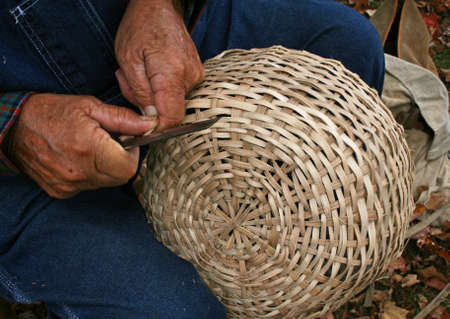 Man crafting wicker basket