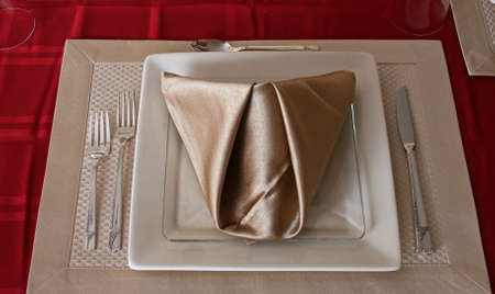 Formal place setting with folded napkinの写真素材