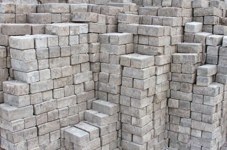 Stacked pile of cement bricks