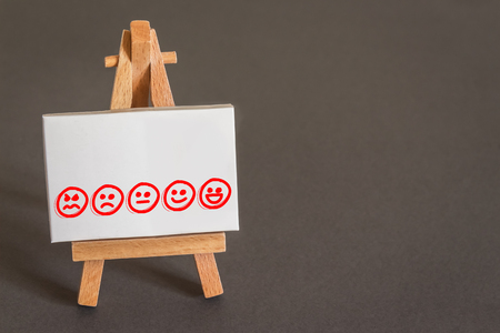 Smileys on a Canvas representing Customer Satisfaction Measurementの写真素材