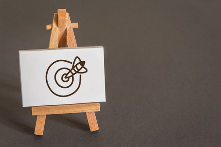 Drawing of a Target an an Arrow on Canvas upon an Easelの写真素材