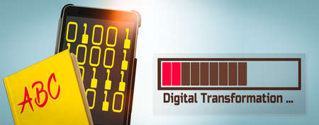 Banner with a Yellow Book and a Tablet Computer showing a Loading Bar and the Text Transformationの写真素材