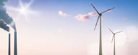 Wind Turbines and the Smoke Stacks of a Coal Fired Power Plant on a Panoramic Bannerの写真素材
