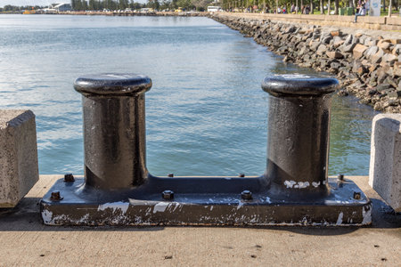 Ship anchoring bollards on the edge of Newcastle Harbour, Australia, heavy steel maritime...