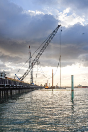Newcastle Harbour with shipping vessels, port infrastructure, and transport activity. Industrial...