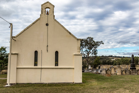 View of an old church in a rural setting, surrounded by farmland and natural scenery. Rustic...