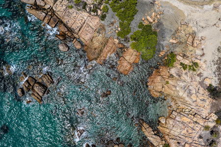 An aerial view of Rose Bay in Bowen, Queensland, reveals a stunning tropical coastline with...