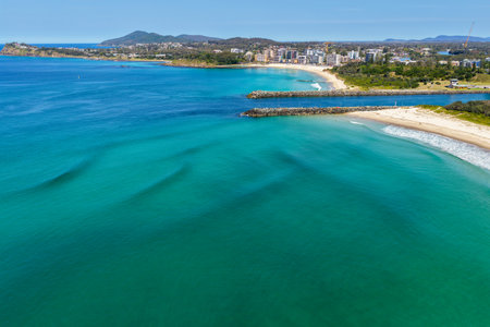 A breathtaking aerial view of Forster on the Mid North Coast of New South Wales, showcasing turquoise ocean waters, white sandy beaches, and the bridge linking Forster and Tuncurryの写真素材
