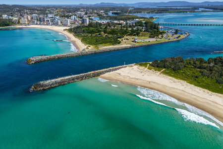 A breathtaking aerial view of Forster on the Mid North Coast of New South Wales, showcasing turquoise ocean waters, white sandy beaches, and the bridge linking Forster and Tuncurryの写真素材