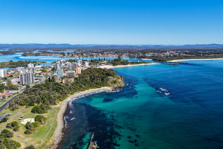 A breathtaking aerial view of Forster on the Mid North Coast of New South Wales, showcasing turquoise ocean waters, white sandy beaches, and the bridge linking Forster and Tuncurryの写真素材
