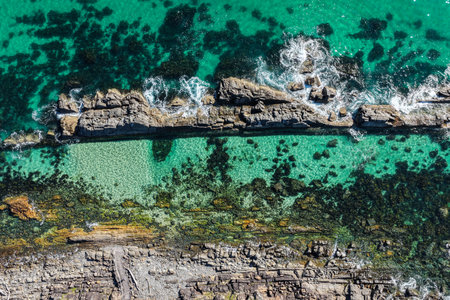 A breathtaking aerial view of Forster on the Mid North Coast of New South Wales, showcasing turquoise ocean waters, white sandy beaches, and the bridge linking Forster and Tuncurryの写真素材