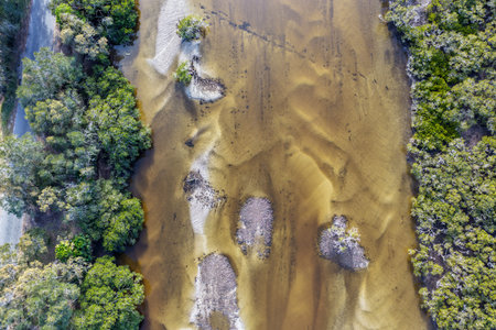 A breathtaking aerial view of Forster on the Mid North Coast of New South Wales, showcasing turquoise ocean waters, white sandy beaches, and the bridge linking Forster and Tuncurryの写真素材