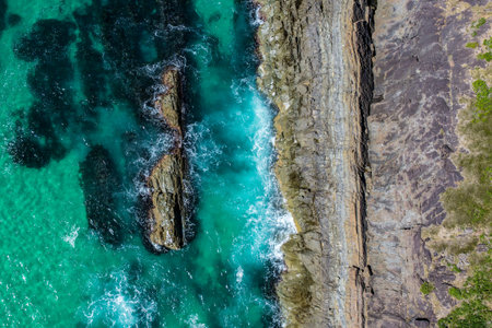 A breathtaking aerial view showcasing turquoise ocean waters and the natural beauty of the coastline