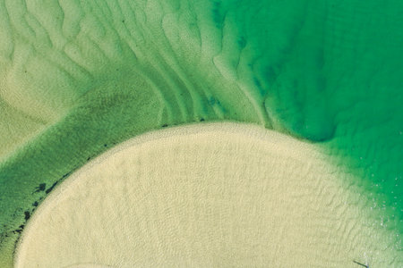 A breathtaking aerial view showcasing turquoise ocean waters, white sandy beaches