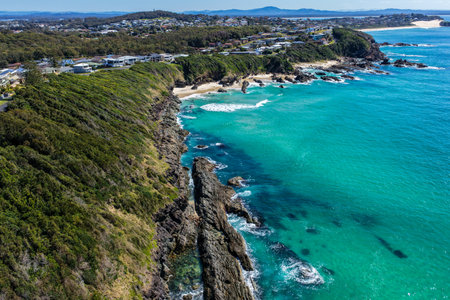 A breathtaking aerial view of Forster on the Mid North Coast of New South Wales, showcasing turquoise ocean waters, white sandy beaches, and the bridge linking Forster and Tuncurryの写真素材