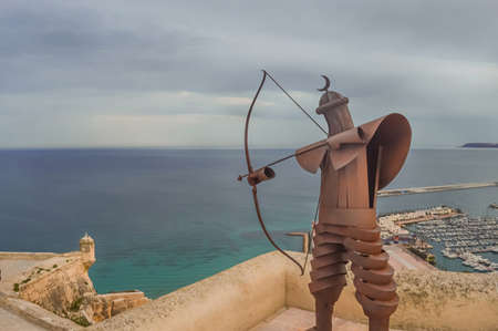 Alicante, Spain - October, 5, 2015: Metal statue of Medieval archer shooting bow in Santa Barbara Castle of Alicante, Spain.のeditorial素材