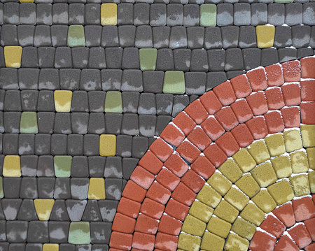 Wet tile paving slab with circle element with melting snow.の写真素材