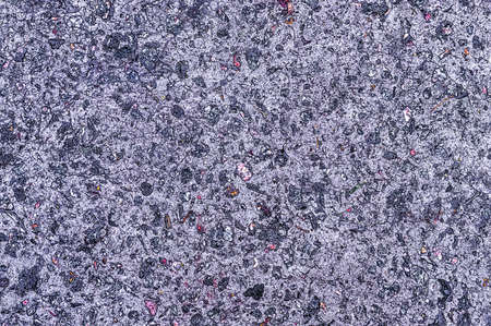 Artificial blue stone texture with colored particles.