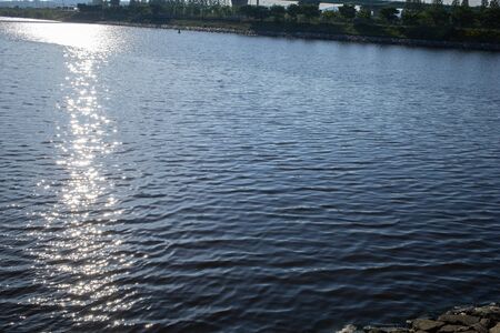 the sun's rays on the calm riverの写真素材