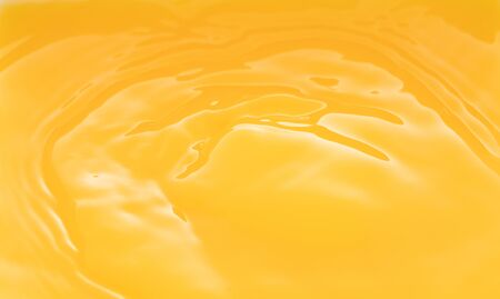 the waves after a few drops of orange juice.の写真素材