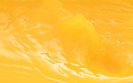 the waves after a few drops of orange juice.の写真素材