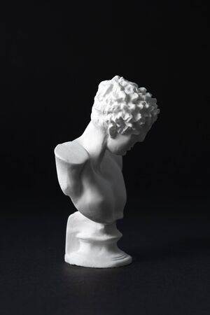 Hermes plaster figure in black backgroundの写真素材