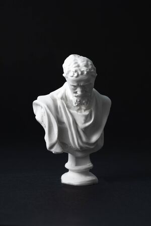Michelangelo plaster figure in black backgroundの写真素材