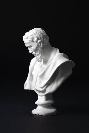 Michelangelo plaster figure in black backgroundの写真素材